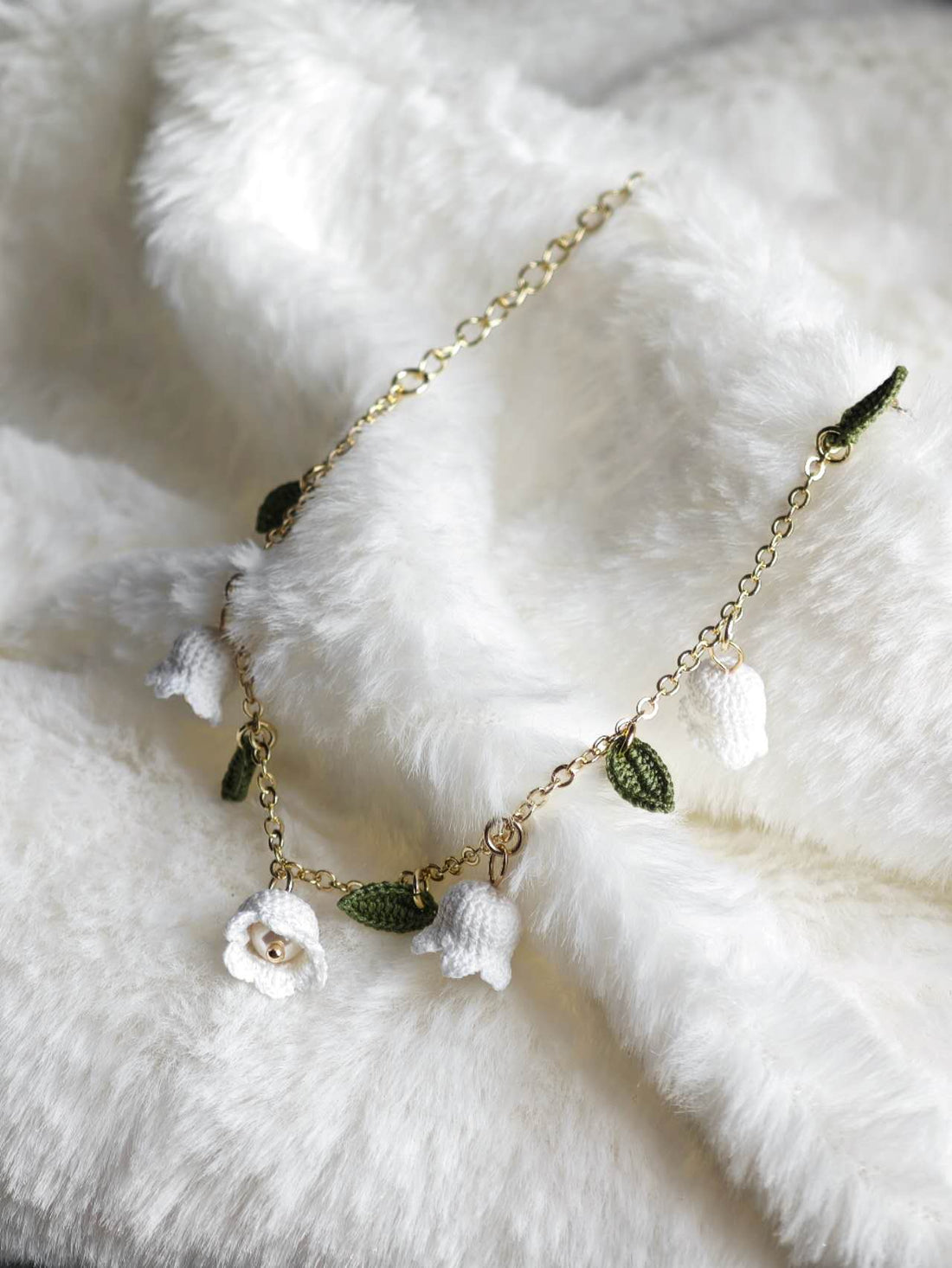 Handmade bracelet with lily of the valley in micro-crochet