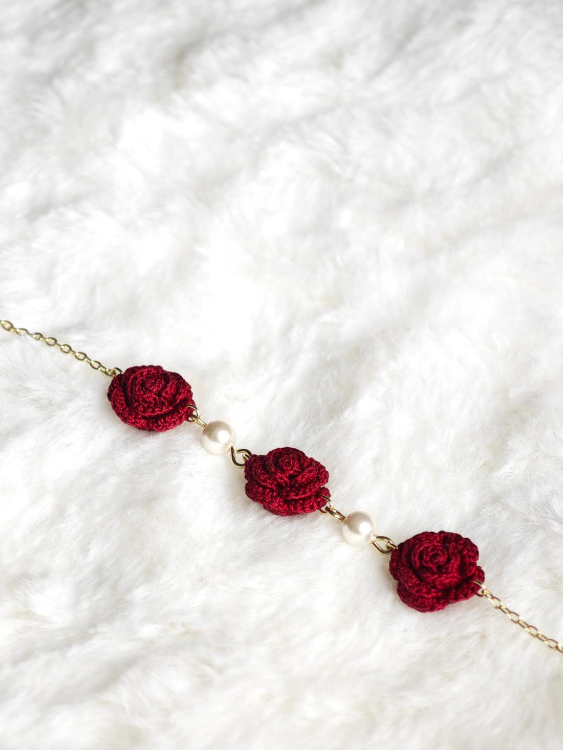 Handmade bracelet with three burgundy roses in micro-crochet
