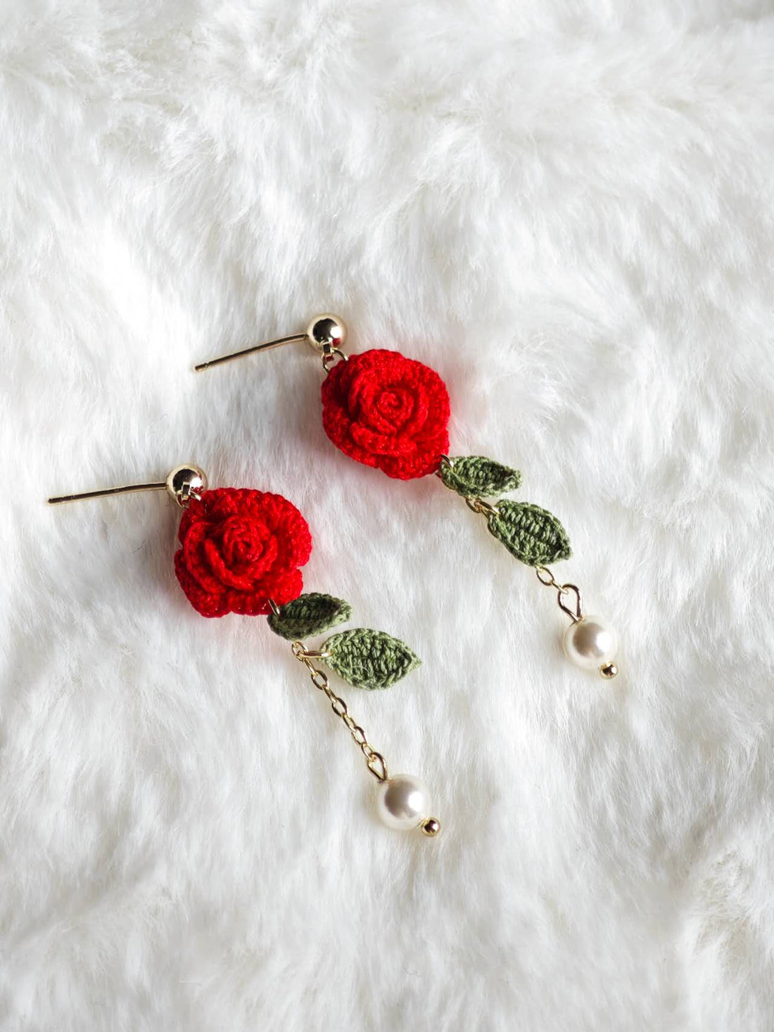 Handmade earrings with micro-crochet rose
