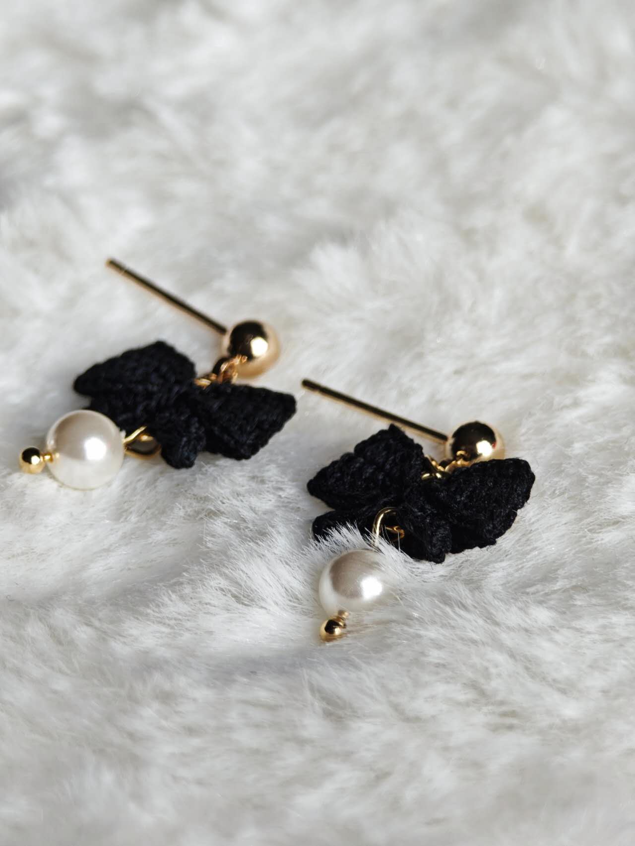 Handmade earrings with black bow in micro-crochet