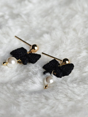 Handmade earrings with black bow in micro-crochet