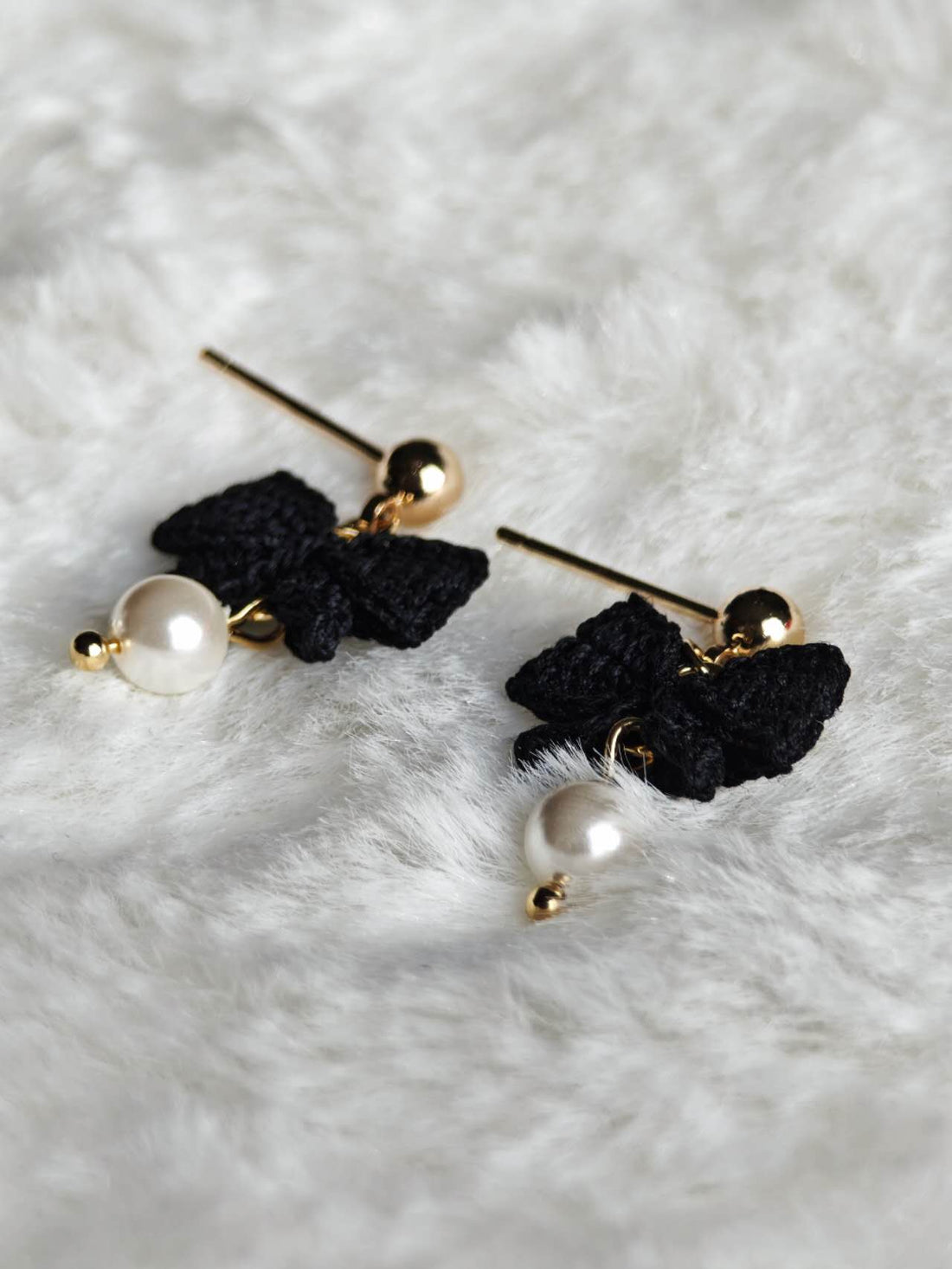 Handmade earrings with black bow in micro-crochet